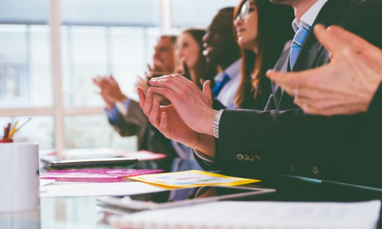 business people clapping at a conference 